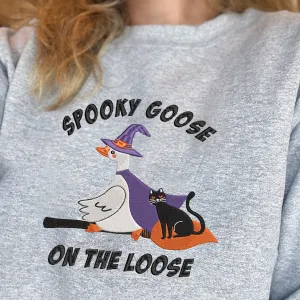 Teesdily | Halloween Witch Goose Embroidered Shirt, Spooky Goose On The Loose Sweatshirt Embroidery, Funny Goose And Black Cat Halloween Shirt Gift